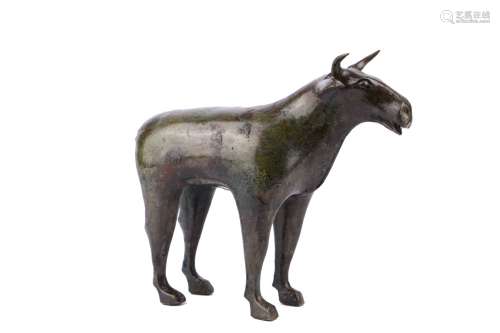 AN ARCHAIC BRONZE MODEL OF STANDING BUFFALO