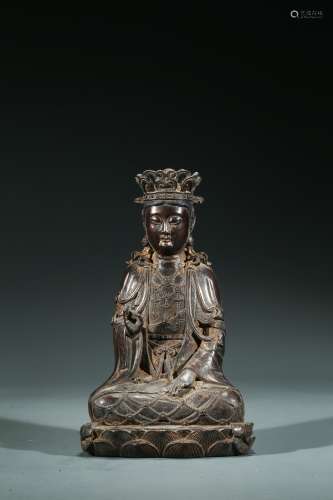 A CHINESE PARCEL-GILT BRONZE FIGURE OF SEATED GUANYIN