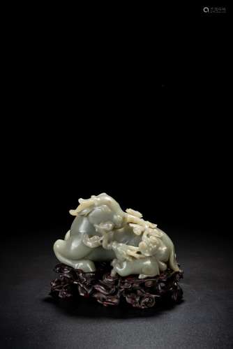 A CHINESE CELADON JADE CARVING OF DEER GROUP