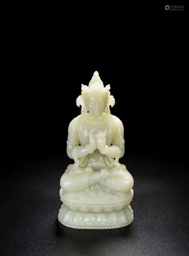 A CHINESE WHITE JADE CARVED FIGURE OF VAIROCANA