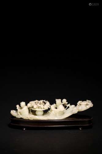 A CHINESE WHITE JADE 'IMMORTALS ON LOG RAFT' BRUSHREST