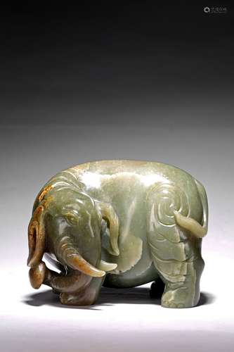 A GREEN JADE CARVING OF ELEPHANT