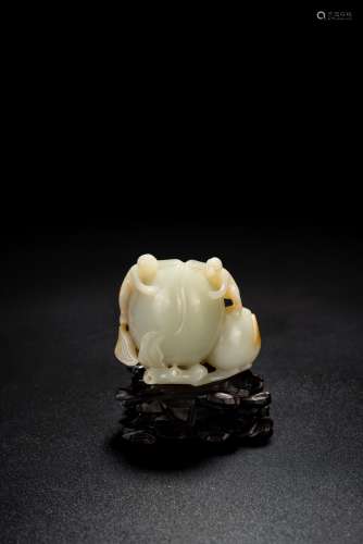 A WHITE JADE CARVING OF PEACH AND MONKEYS
