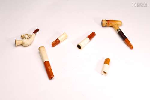 A SET OF 6 AMBER CIGARETTE HOLDERS