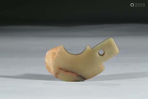 A CELADON 'AXE' FORM PENDANT