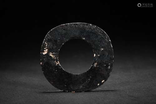 A DARK OPAQUE JADE CARVED DISC