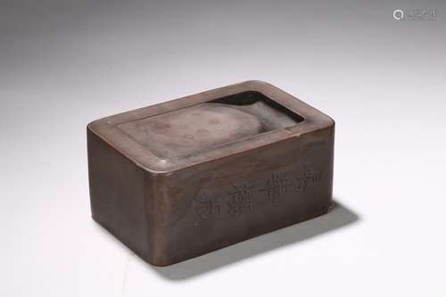 A RECTANGULAR AND INSCRIBED INKSTONE