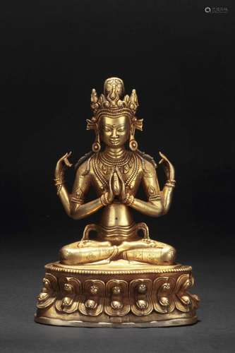 A GILT BRONZE FOUR-ARMED AVALOKITESVARA