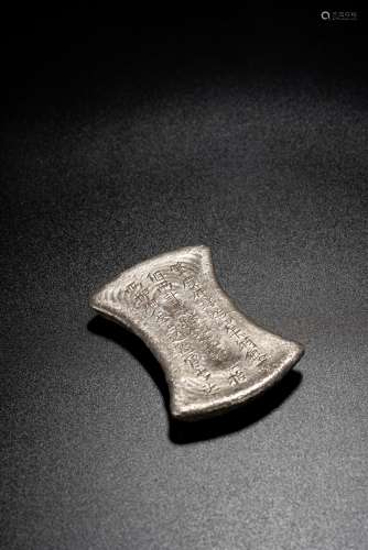 A CHINESE SILVER INGOT WITH INSCRIPTIONS