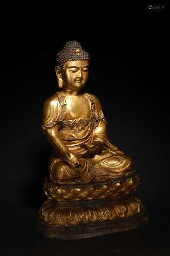 A GILT BRONZE FIGURE OF SHAKYAMUNI