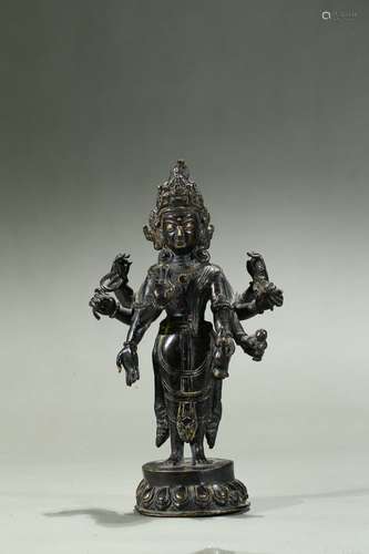 A BRONZE FIGURE OF SIX-ARMED BODHISATTVA