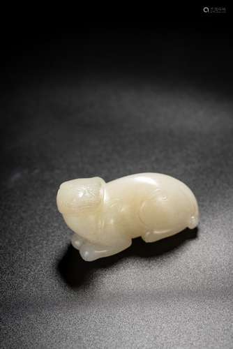 A CHINESE WHITE JADE CARVED MYTHICAL BEAST