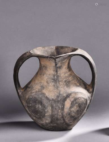 A TWO HANDLED POTTERY VASE