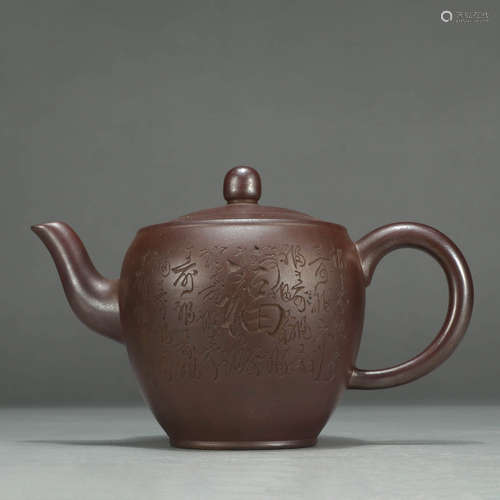 AN INSCRIBED ZISHA TEAPOT