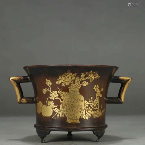 A FLORAL BRONZE DOUBLE-EARED TRIPOD CENSER