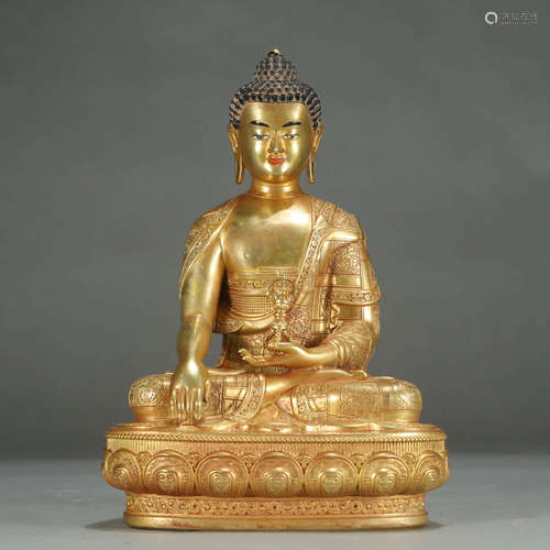 A GILT-BRONZE STATUE OF SHAKYAMUNI