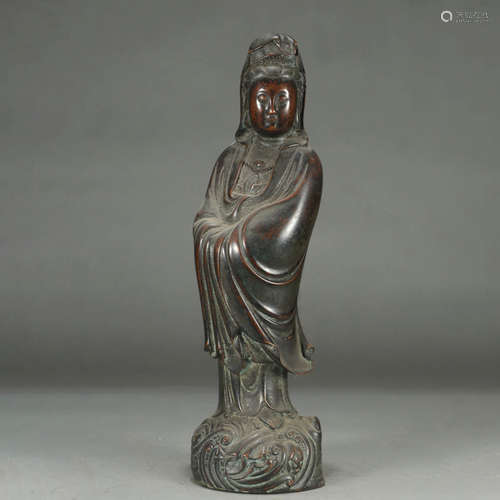 A BRONZE GUANYIN STATUE