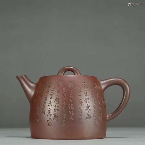 AN INSCRIBED ZISHA TEAPOT