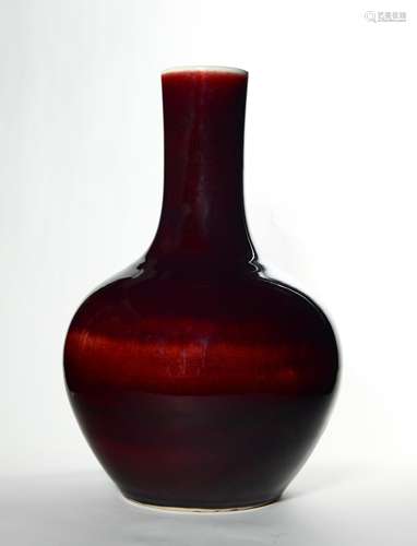 A RED GLAZED PORCELAIN BOTTLE VASE