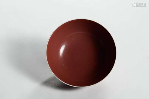 A RED GLAZED PORCELAIN BOWL