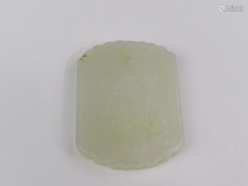 A Chinese white jade ‘fisher man’ pendant