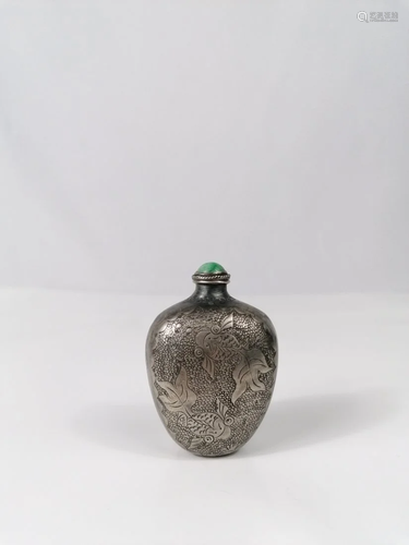 A Chinese silver carved snuff bottle