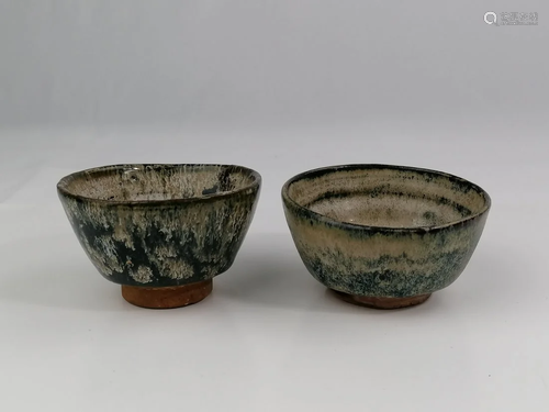 A pair of Japanese pottery tea bowls