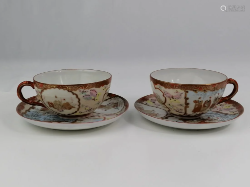 A pair of Japanese porcelain cup and saucers