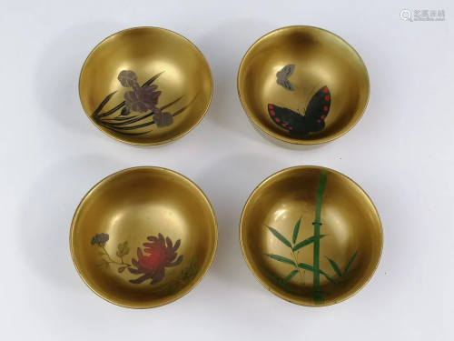 A set of Japanese gold lacquer tea cups