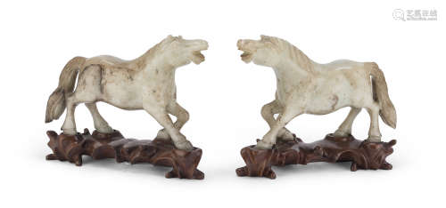 A PAIR OF CHINESE SERPENTINE SCULPTURES DEPICTING HORSES. MID-20TH CENTURY.