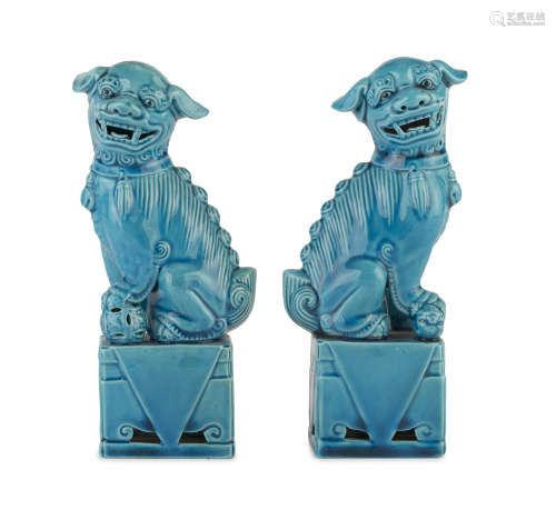 A PAIR OF TURQUOISE GLAZED PORCELAIN SCULPTURES OF BUDDHIST LIONS. CHINA 20TH CENTURY.