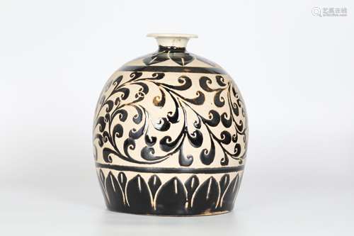 Ming, black glaze carved flower Zun