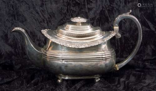 George IV silver tea pot of oval form having a reeded body with applied scroll and shell rim, a