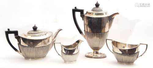 Late Victorian silver tea and coffee service comprising a coffee pot and tea pot, both with ebonised