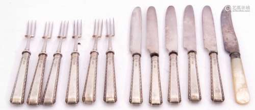 Set of six George V silver handled fruit forks with plated prongs, together with five matching