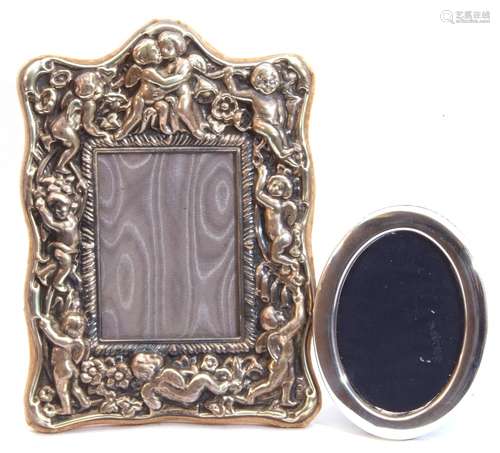 Mixed Lot: an ornate EPNS photograph frame, heavily embossed with cherubs and flowers, easel back,