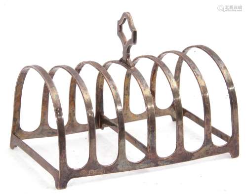 George V silver toast rack of rectangular form, six divisions and central pierced carrying handle