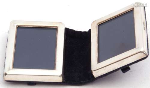 Modern white metal folding small double photograph frame in a blue velvet case, 7 x 5cm, London,