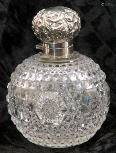 Late Victorian cut glass and silver mounted scent bottle, the hinged cover embossed with scrolls, to