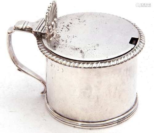 George IV silver drum mustard, the hinged lid with shell thumb piece and capped scroll handles,