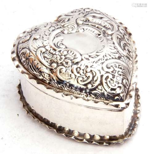 Late Victorian silver heart shaped trinket box, the hinged lid embossed with scrolls etc and crimped