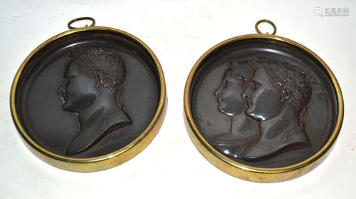 Two metal plaques with heads of Roman emperors