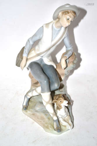 Lladro figure of a young boy with hound by his feet