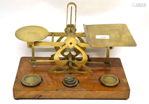 Set of postal scales with weights, on wooden mount, 33cm long