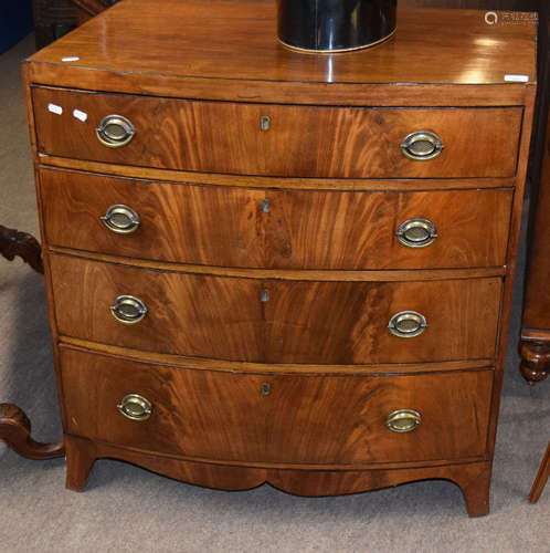 Late Georgian mahogany bow front chest of four graduated drawers with embossed oval brass handles,