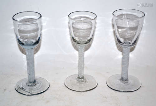 Group of three mid-18th century wine glasses with air twist stems (3)