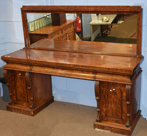 Early 19th century mahogany large mirror back twin pedestal sideboard, fitted with concave drawers