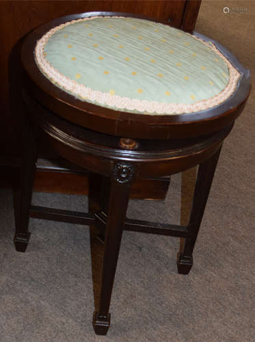 Edwardian period revolving top circular piano stool on four tapering square legs with spade feet,