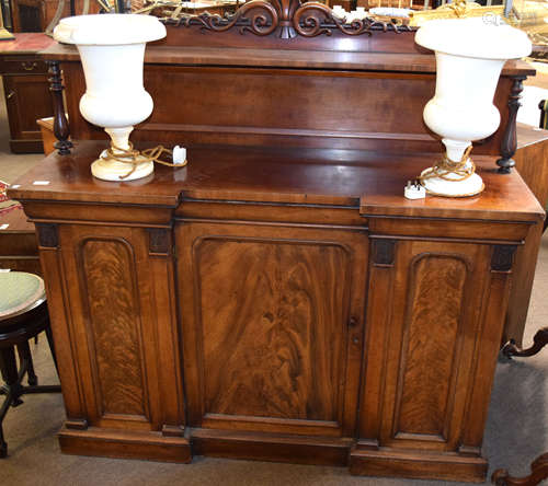 19th century mahogany break front sideboard, scroll moulded pediment over a shelf supported by