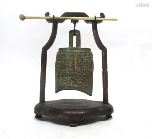 Oriental model of a temple bell in wooden mount